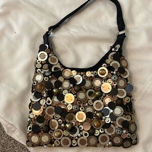 Fun party purse with gold, silver and bronze accents